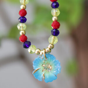 pulsera con dije flor azul